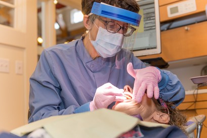 dentist working on patient for cosmetic dentistry