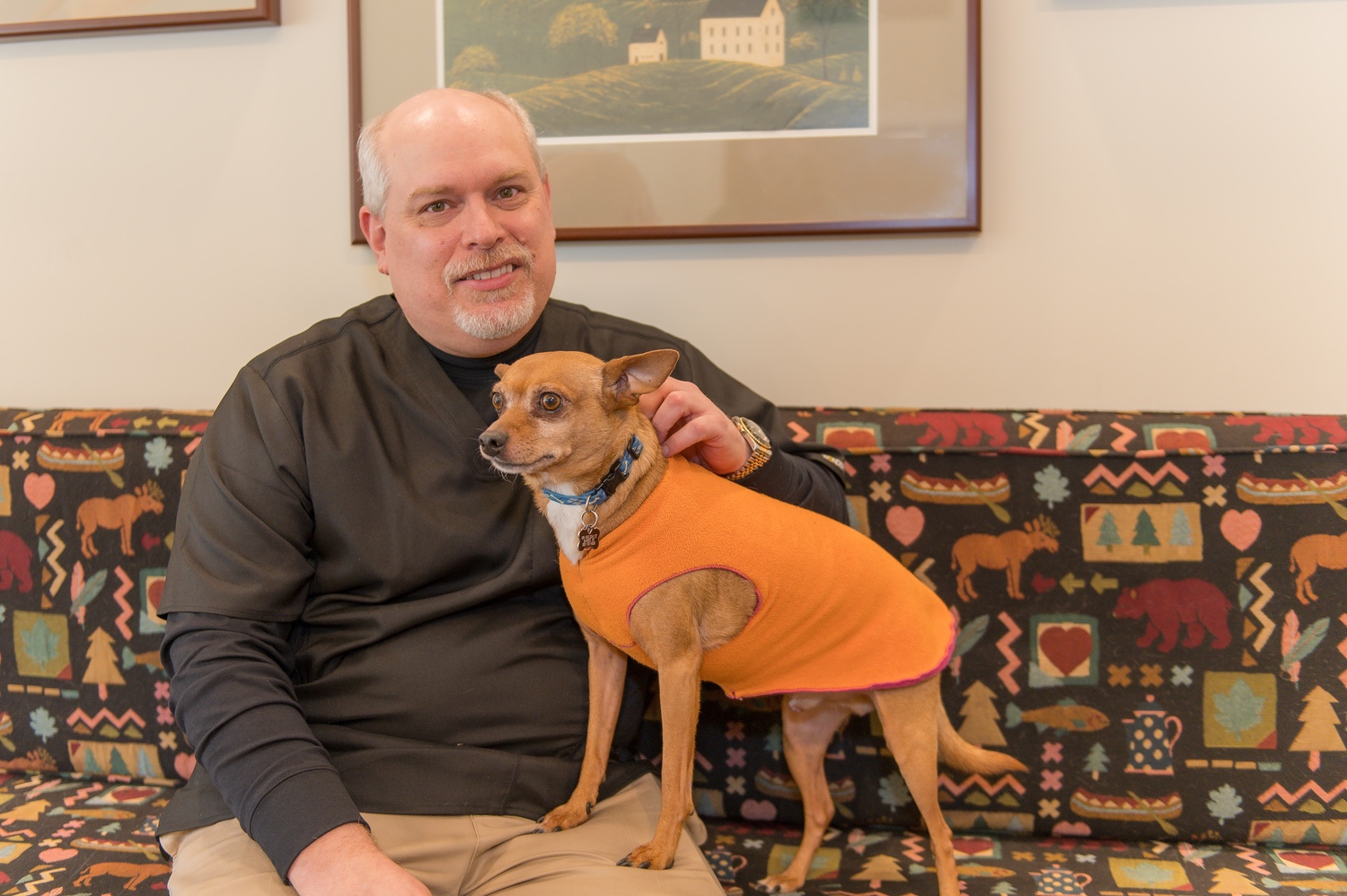 man and his dog at dentist